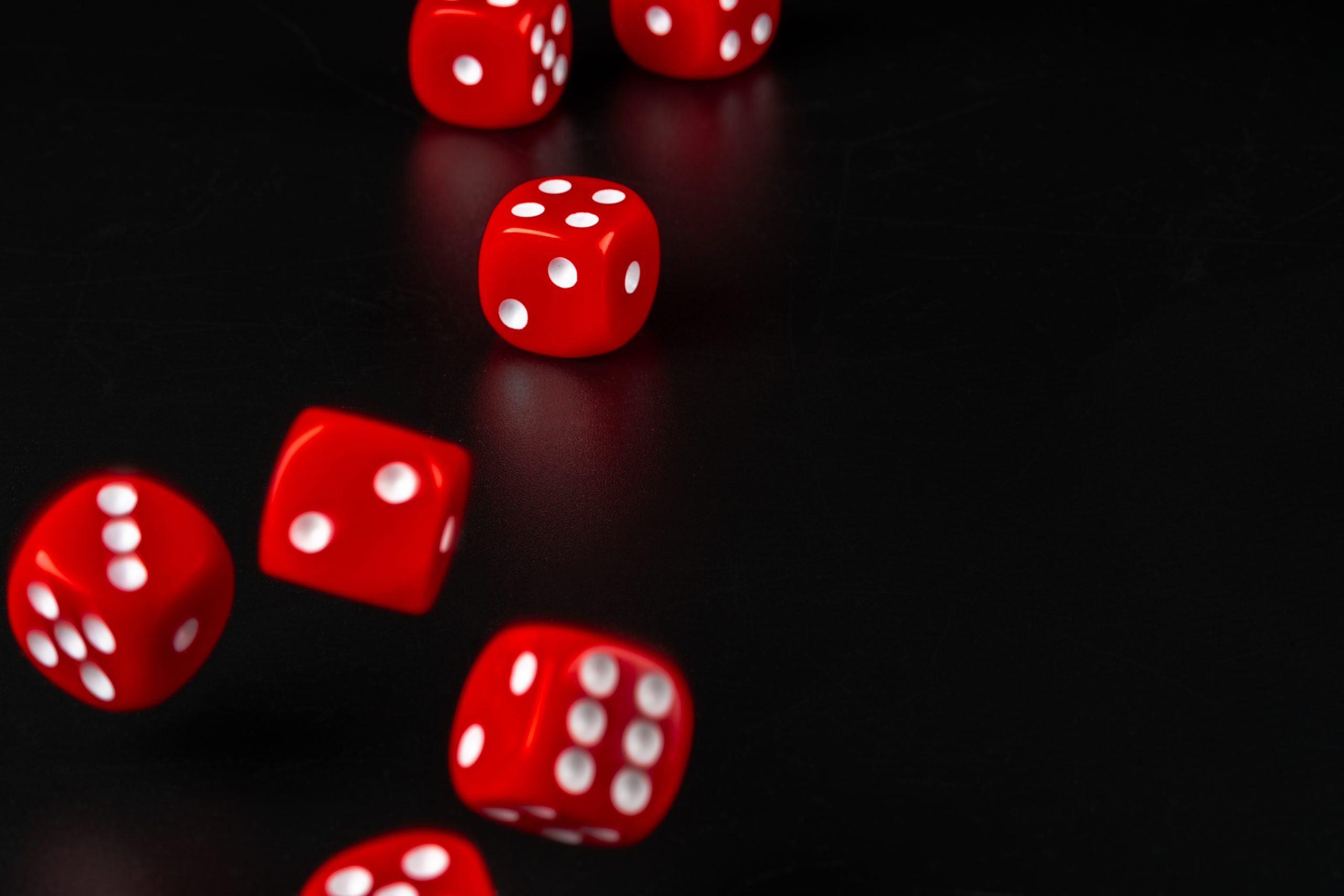 Group of dice close up on dark black background